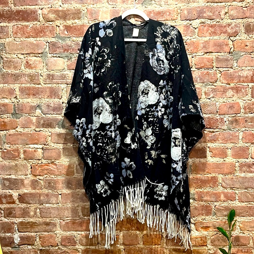 Black, grey, and white poncho. Fancy and lightweight.